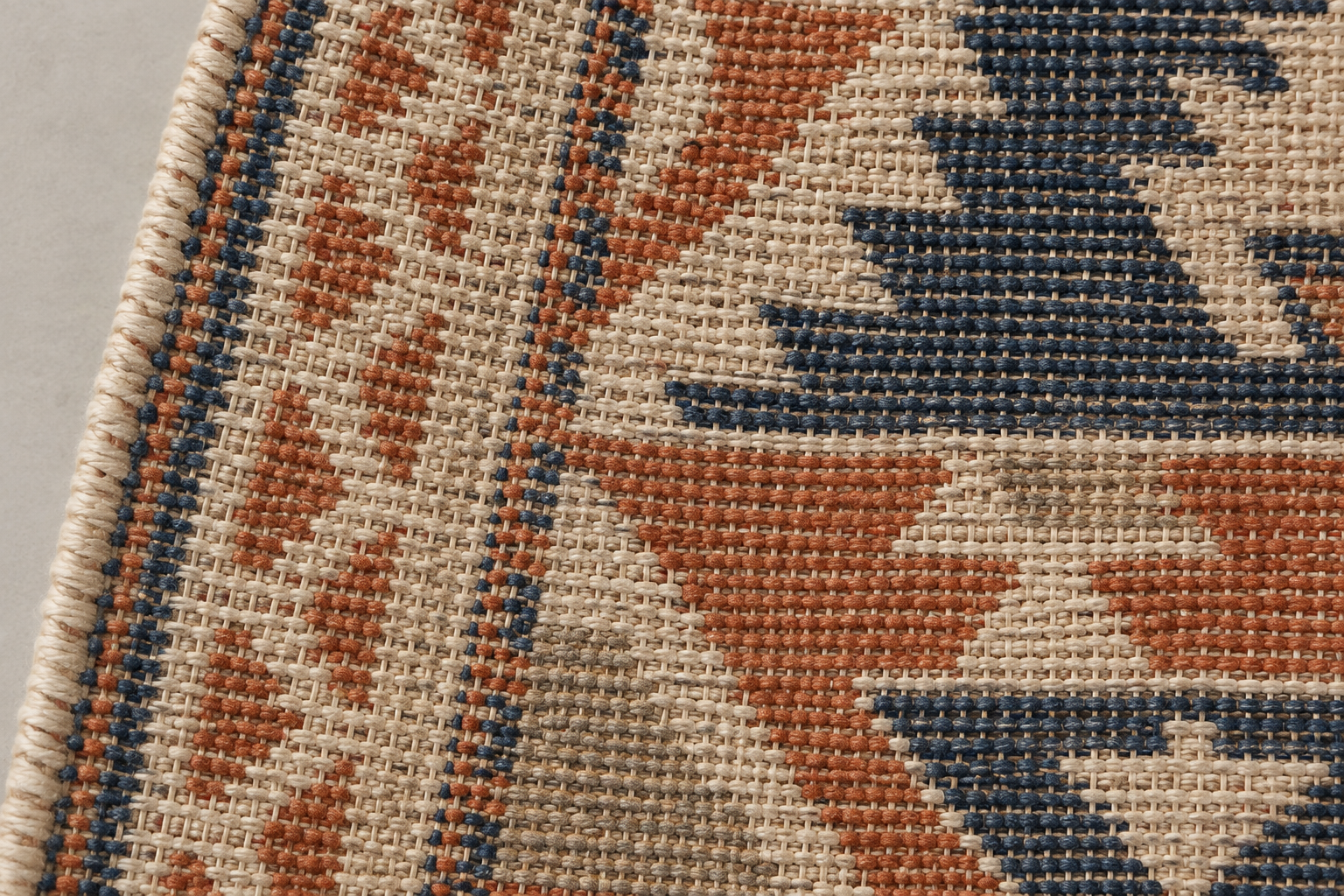 Flatweave rug photographed from the back, showing its woven structure