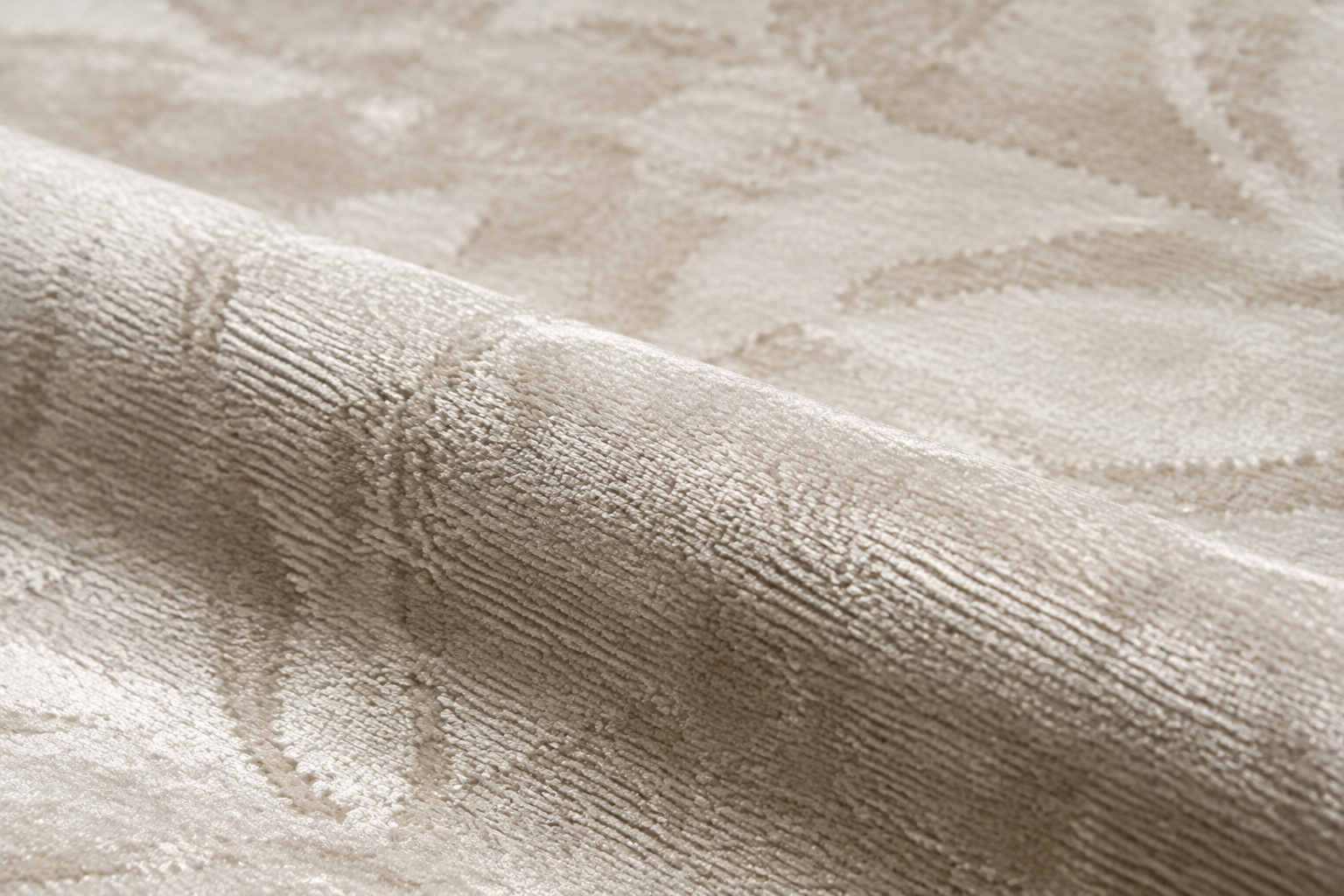 Close-up of a luxurious Tencel rug showing its smooth surface and subtle light-r…